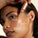 The image shows a woman applying